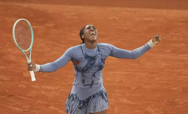 Coco Gauff of the U.S. celebrates as she won the quarterfinal match of the French Tennis Open against Madison Keys of the U.S. at the Roland-Garros stadium in Paris, Wednesday, June 4, 2025. (AP Photo/Christophe Ena)