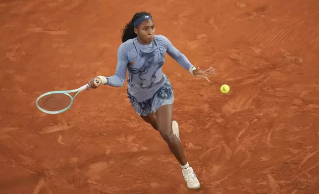 Coco Gauff of the U.S. plays a shot against Madison Keys of the U.S. during their quarterfinal match of the French Tennis Open at the Roland-Garros stadium in Paris, Wednesday, June 4, 2025. (AP Photo/Christophe Ena)