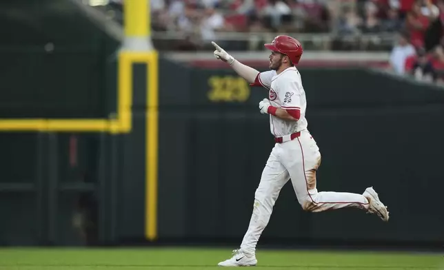 Cincinnati Reds' Gavin Lux reacts after hitting a solo home run during the fourth inning of a baseball game against the New York Yankees, Monday, June 23, 2025, in Cincinnati. (AP Photo/Joshua A. Bickel)