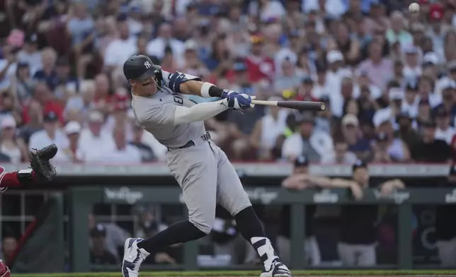 New York Yankees' Aaron Judge hits a solo home run during the first inning of a baseball game against the Cincinnati Reds, Monday, June 23, 2025, in Cincinnati. (AP Photo/Joshua A. Bickel)