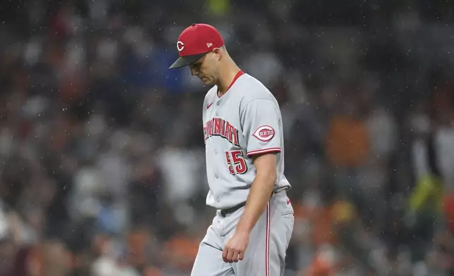 Cincinnati Reds pitcher Taylor Rogers walks to the dugout against the Detroit Tigers in the sixth inning during a baseball game, Friday, June 13, 2025, in Detroit. (AP Photo/Paul Sancya)
