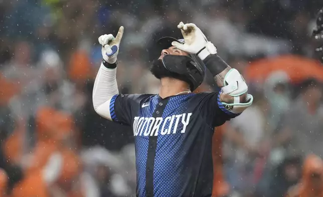 Detroit Tigers' Gleyber Torres celebrates his home run against the Cincinnati Reds in the seventh inning during a baseball game, Friday, June 13, 2025, in Detroit. (AP Photo/Paul Sancya)