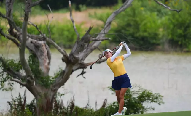 Minjee Lee watchers her shot the 14th hole during the first round of the Women's PGA Championship golf tournament Thursday, June 19, 2025, Frisco, Texas. (AP Photo/LM Otero)