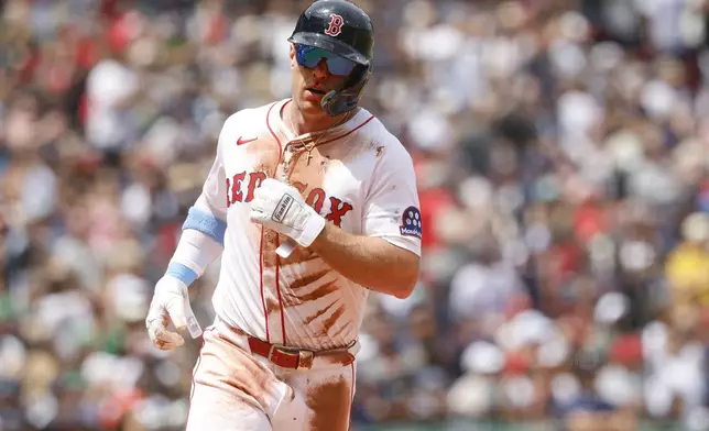 Boston Red Sox's Romy Gonzalez crosses home plate to score during in the first inning of a baseball game against the New York Yankees, Sunday, June 15, 2025, in Boston. (AP Photo/Greg M. Cooper)