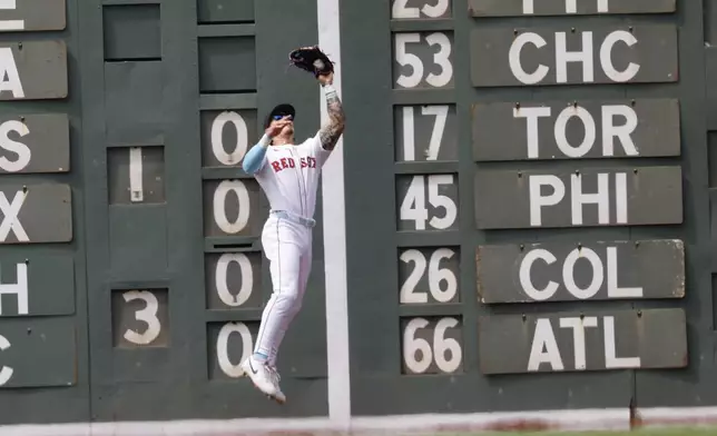 Boston Red Sox's Jarren Duran catches a fly ball hit by New York Yankees' Ben Rice in the fifth inning of a baseball game, Sunday, June 15, 2025, in Boston. (AP Photo/Greg M. Cooper)