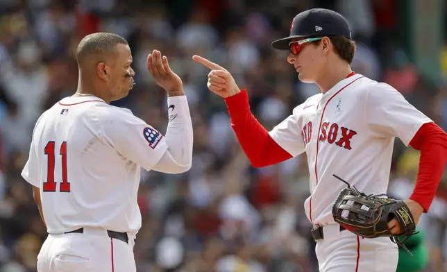 Boston Red Sox's Roman Anthony, right, celebrates with designated hitter Rafael Devers (11) after defeating the New York Yankees in a baseball game, Sunday, June 15, 2025, in Boston. (AP Photo/Greg M. Cooper)