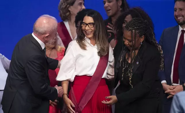 FILE - First lady Rosangela da Silva receives the Order of Cultural Merit from her husband, President Luiz Inacio Lula da Silva, and Minister of Culture Margareth Menezes, during an awards ceremony at the Gustavo Capanema Palace in Rio de Janeiro, May 20, 2025. (AP Photo/Bruna Prado, File)