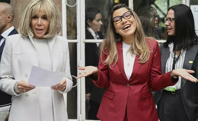 FILE - Brazalian first lady Rosangela da Silva, right, accompanied by France's first lady Brigitte Macron, left, speaks to students as they visit a high school Montaigne in Paris, June 5, 2025. (Bertrand Guay, AP File Photo)