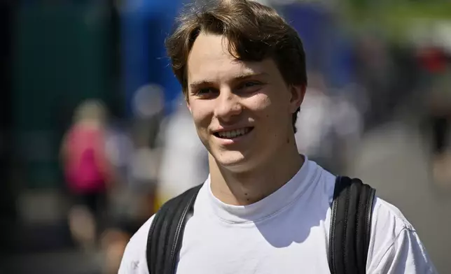 McLaren driver Oscar Piastri of Australia walks through the paddock at the Red Bull Ring racetrack, in Spielberg, Austria, Thursday, June 26, 2025, ahead of the Austrian Formula One Grand Prix. (AP Photo/Denes Erdos)