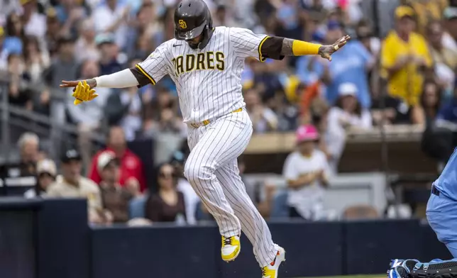 San Diego Padres' Martín Maldonado scores in the third inning of a baseball game against the Kansas City Royals, Saturday, June 21, 2025, in San Diego. (AP Photo/Tony Ding)