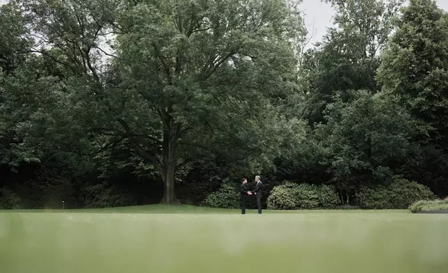 Netherland's Prime Minister Dick Schoof, right, speaks with Ukraine's President Volodymyr Zelenskyy during a meeting at the Catshuis on the sidelines of the NATO summit in The Hague, Netherlands, Tuesday, June 24, 2025. (AP Photo/Markus Schreiber)
