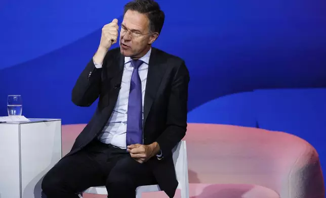 NATO Secretary General Mark Rutte addresses the audience at the NATO public forum on the sidelines of the NATO summit in The Hague, Netherlands, Tuesday, June 24, 2025. (AP Photo/Geert Vanden Wijngaert)