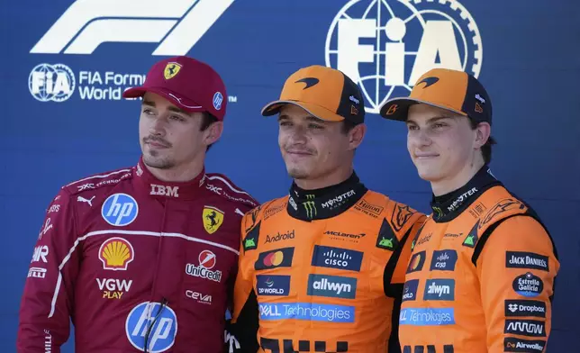 Frome the left, Ferrari driver Charles Leclerc of Monaco, second place, McLaren driver Lando Norris of Britain, first place, and McLaren driver Oscar Piastri of Australia stand on the podium after the qualifying at the Red Bull Ring racetrack, ahead of the Austrian Formula One Grand Prix in Spielberg, Austria, Saturday, June 28, 2025. (AP Photo/Darko Bandic)