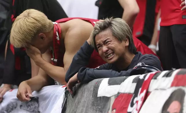 Urawa Red Diamonds fans react after losing against Inter Milan during the Club World Cup Group E soccer match between Inter Milan and Urawa Red Diamonds in Seattle, Saturday, June 21, 2025. (AP Photo/Ryan Sun)