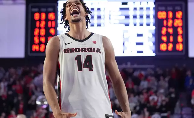 FILE - Georgia forward Asa Newell (14) reacts to a win against Kentucky after an NCAA college basketball game, Tuesday, Jan. 7, 2025, in Athens, Ga. (AP Photo/Brynn Anderson, File)