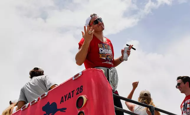Florida Panthers' Matthew Tkachuk shows his championship ring during the NHL hockey team's Stanley Cup championship celebration, Sunday, June 22, 2022, in Fort Lauderdale, Fla. (AP Photo/Michael Laughlin)