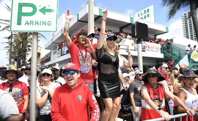 Florida Panthers fans cheer during the NHL hockey team's Stanley Cup championship celebration, Sunday, June, 22, 2025, in Fort Lauderdale, Fla. (AP Photo/Michael Laughlin)