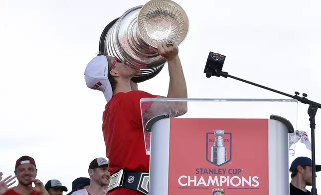 Florida Panthers' Matthew Tkachuk kisses the Stanley Cup during the NHL hockey team's Stanley Cup championship celebration, Sunday, June 22, 2025, in Fort Lauderdale, Fla. (AP Photo/Michael Laughlin)