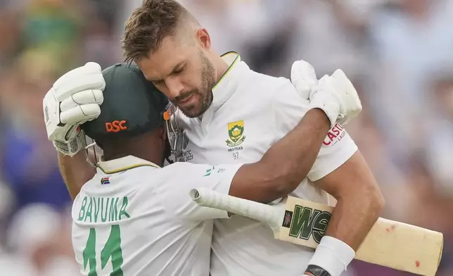South Africa's Aiden Markram, right, celebrates with batting partner Temba Bavuma after scoring a century on day three of the World Test Championship final between South Africa and Australia at Lord's cricket ground in London, Friday, June 13, 2025. (AP Photo/Kirsty Wigglesworth)