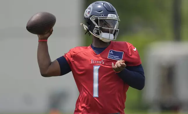 Tennessee Titans quarterback Cam Ward (1) looks to throw a pass during practice at NFL football minicamp, Tuesday, June 10, 2025, in Nashville, Tenn. (AP Photo/George Walker IV)