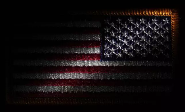 A morale patch embroidered with the United States flag is seen, Friday, June 6, 2025, in Marple Township, Pa. (AP Photo/Matt Slocum)