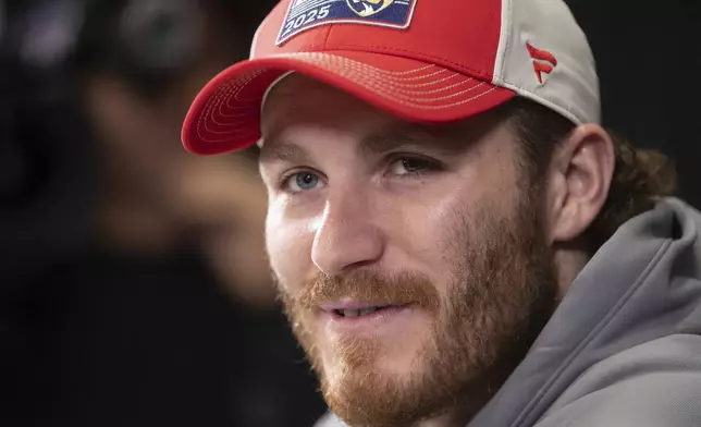 Florida Panthers' Matthew Tkachuk (19) speaks to media during a news conference, Tuesday, June 3, 2025, in Edmonton, Alberta, ahead of Game 1 of the NHL hockey Stanley Cup final series against the Edmonton Oilers. (Jason Franson/The Canadian Press via AP)
