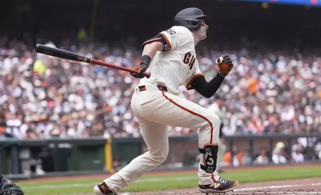 San Francisco Giants' Mike Yastrzemski watches his two-run double during the fourth inning of a baseball game against the Atlanta Braves in San Francisco, Sunday, June 8, 2025. (AP Photo/Jeff Chiu)