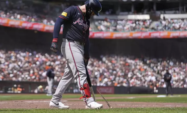 Atlanta Braves' Alex Verdugo breaks his bat on the ground after striking out against the San Francisco Giants during the ninth inning of a baseball game in San Francisco, Sunday, June 8, 2025. (AP Photo/Jeff Chiu)