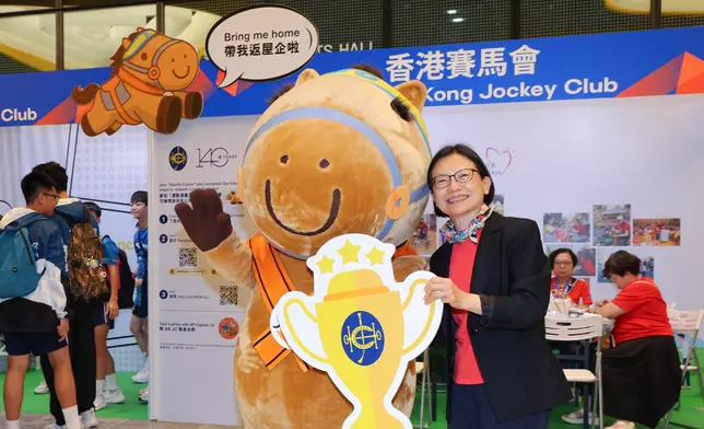 Anita Fung, Steward of The Hong Kong Jockey Club visits the Jockey Club booth.