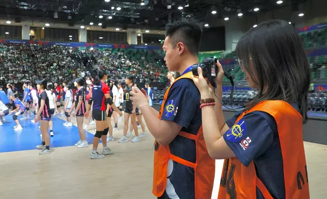 Students from the Hong Kong Jockey Club Junior Sports Reporters Programme are conducting on-site interviews at the Volleyball Nations League Hong Kong tournament.