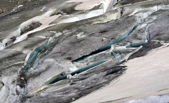 A lake of meltwater has formed on the tongue of the Rhone Glacier near Goms, Switzerland, June 10, 2025. (AP Photo/Matthias Schrader)