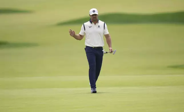 Bryson DeChambeau walks down the 12th fairway during the second round of the U.S. Open golf tournament at Oakmont Country Club Friday, June 13, 2025, in Oakmont, Pa. (AP Photo/Seth Wenig)