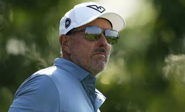 Phil Mickelson watches his tee shot on the 13th hole during the first round of the U.S. Open golf tournament at Oakmont Country Club Thursday, June 12, 2025, in Oakmont, Pa. (AP Photo/Carolyn Kaster)