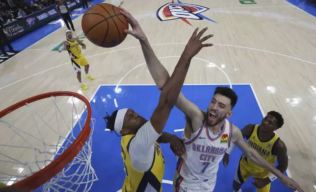 Oklahoma City Thunder forward Chet Holmgren (7) dunks against the Indiana Pacers during the second half of Game 5 of the NBA Finals basketball series, Monday, June 16, 2025, in Indianapolis. (Matthew Stockman/Pool Photo via AP)