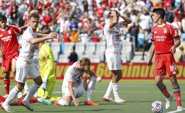 Bayern Munich's Harry Kane , kneeling, reacts after a miss during the Club World Cup Group C soccer match between Benfica and Bayern Munich in Charlotte, N.C., Tuesday, June 24, 2025. (AP Photo/Nell Redmond)