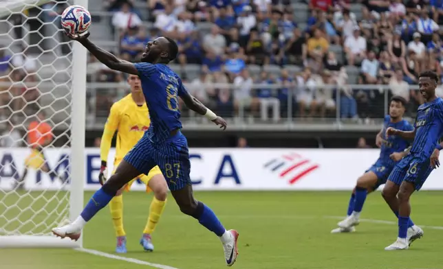 Al-Hilal's Hassan Al-Tombakti grabs the ball and reacts after missing a chance during the Club World Cup Group H soccer match between Salzburg and Al Hilal in Washington, Sunday, June 22, 2025. (AP Photo/Julia Demaree Nikhinson)