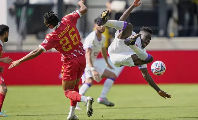 Wydad AC's Selemani Mwalimu and Al Ain's Abdoul Karim Traore collide during the Club World Cup Group G soccer match between Wydad AC and Al Ain FC in Washington, Thursday, June 26, 2025. (AP Photo/Julia Demaree Nikhinson)