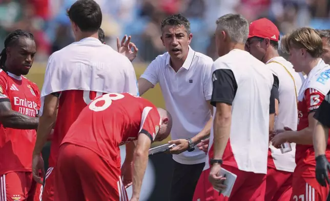 Benfica manager Bruno Lage talks to his players during the Club World Cup Group C soccer match between Benfica and Bayern Munich in Charlotte, N.C., Tuesday, June 24, 2025. (AP Photo/Chris Carlson)