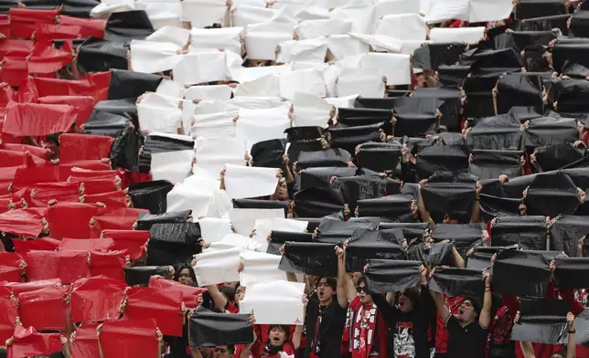Fans make a mosaic on the grandstands prior to the Club World Cup Group E soccer match between Inter Milan and Urawa Red Diamonds in Seattle, Saturday, June 21, 2025. (AP Photo/Ryan Sun)