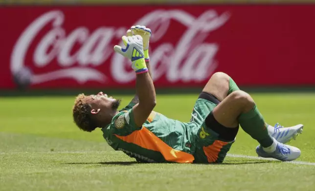 Mamelodi Sundowns goalkeeper Ronwen Williams (30) reacts after he gave the ball away for a goal Borussia Dortmund's Felix Nmecha during the Club World Cup Group F soccer match between Mamelodi Sundowns and Borussia Dortmund in Cincinnati, Saturday, June 21, 2025. (AP Photo/Carolyn Kaster)