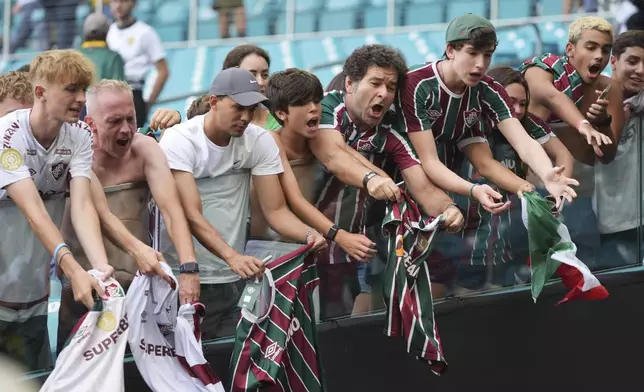 Fluminense fans ask for autographs after the Club World Cup Group F soccer match between Mamelodi Sundowns and Fluminense in Miami Gardens, Fla., Wednesday, June 25, 2025. (AP Photo/Lynne Sladky)