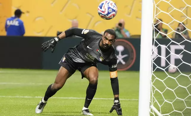 Al Ain's goalkeeper Khalid Eisa watches as Manchester City's Erling Haaland scores his team's third goal from the penalty spot during the Club World Cup Group G soccer match between Manchester City and Al Ain in Atlanta, Sunday, June 22, 2025. (AP Photo/Mike Stewart)