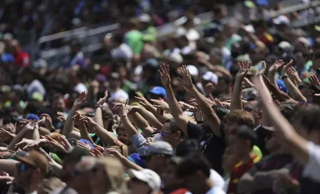 Seattle Sounders fans support their team during the Club World Cup Group B soccer match between Seattle Sounders and PSG in Seattle, Monday, June 23, 2025. (AP Photo/Ryan Sun)