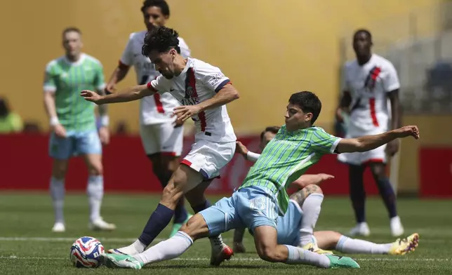Seattle Sounders' Obed Vargas, right, tries to stop Paris Saint-Germain's Vitinha during the Club World Cup Group B soccer match between Seattle Sounders and PSG in Seattle, Monday, June 23, 2025. (AP Photo/Ryan Sun)