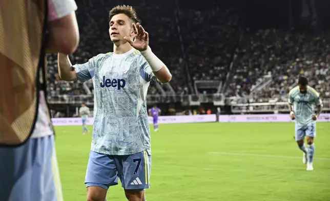 Juventus' Francisco Conceicao is congratulated by teammates after scoring his team's fifth goal during the Club World Cup group G soccer match between Al Ain and Juventus in Washington, Wednesday, June 18, 2025. (AP Photo/Nick Wass)