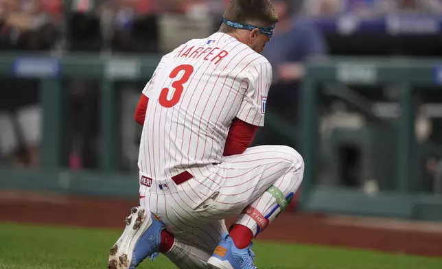 FILE- Philadelphia Phillies' Bryce Harper reacts after being hit by a pitch from Atlanta Braves' Spencer Strider plays during a baseball game, Tuesday, May 27, 2025, in Philadelphia. (AP Photo/Matt Slocum)