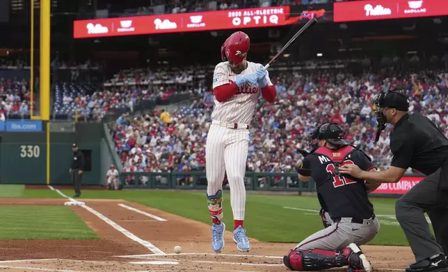 FILE - Philadelphia Phillies' Bryce Harper is hit by a pitch Atlanta Braves' Spencer Strider during a baseball game, Tuesday, May 27, 2025, in Philadelphia. (AP Photo/Matt Slocum)