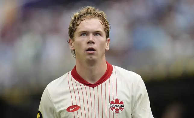 Canada forward Jacob Shaffelburg walks off the field after receiving a red card during the first half of a CONCACAF Gold Cup quarterfinals soccer match against Guatemala, Sunday, June 29, 2025, in Minneapolis. (AP Photo/Abbie Parr)