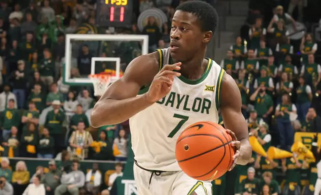FILE - Baylor guard VJ Edgecombe drives the ball to the basket in an NCAA college basketball game against TCU Sunday, Jan.19, 2025, in Waco, Texas. (AP Photo/Jerry Larson, File)