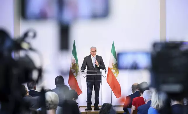 Reza Pahlavi, the son of Iran's toppled Shah Mohammad Reza Pahlavi, speaks during a press conference, Monday, June 23, 2025 in Paris. (AP Photo/Thomas Padilla)